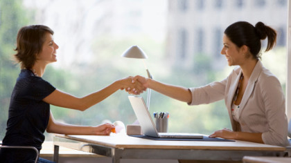 Businesswomen shaking hands